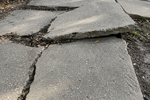 tripped and fell over a raised and uneven sidewalk lawyers near me