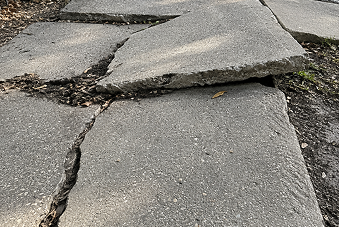 tripped and fell over a raised and uneven sidewalk lawyers near me
